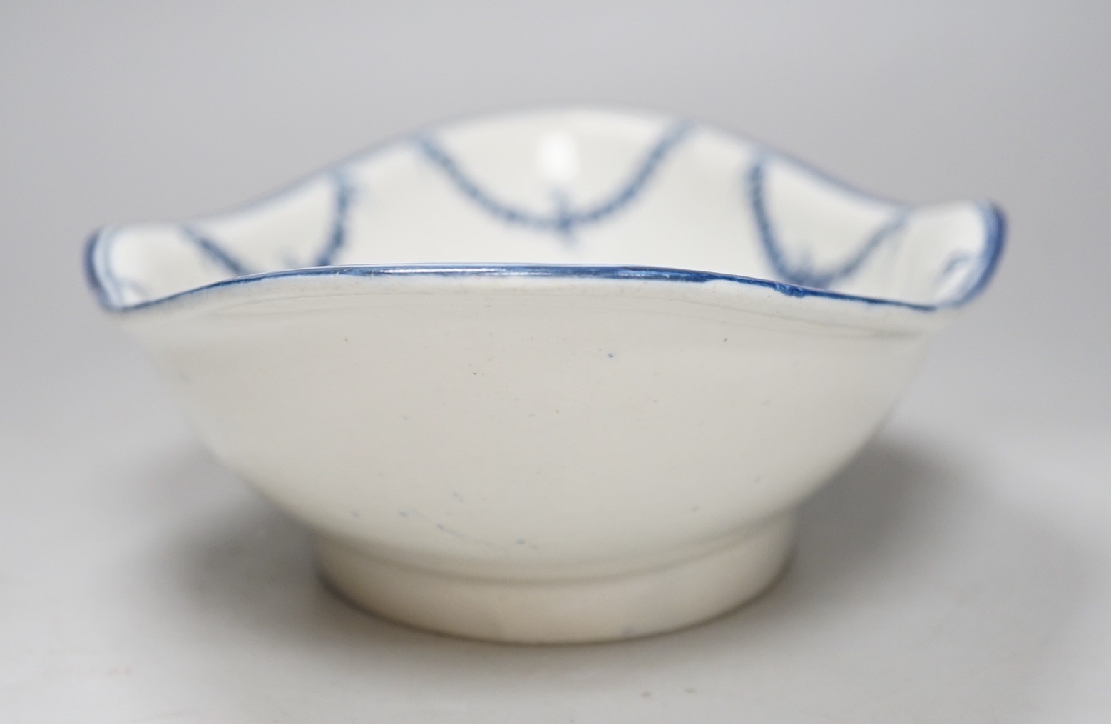 An 18th century Caughley rare Pineapple Dish painted with the Dessert Festoons pattern, 32cms wide